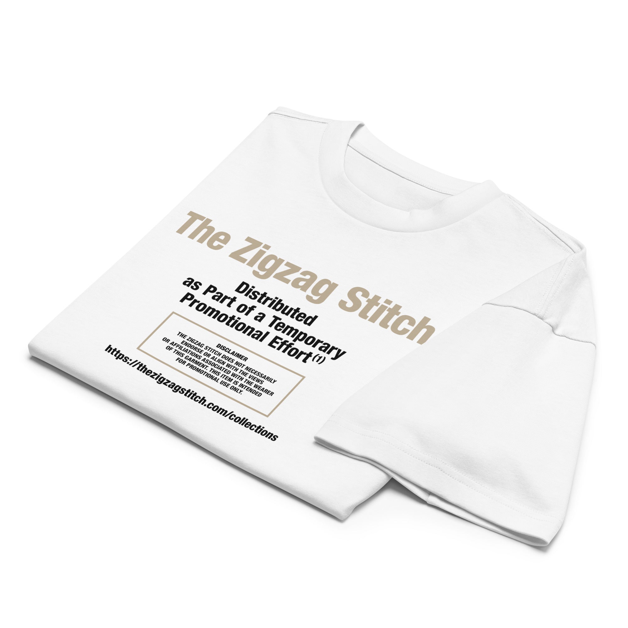 Folded view of white t-shirt with graphic print. Reads “Distributed as Part of a Promotional Effort” designed by The Zigzag Stitch