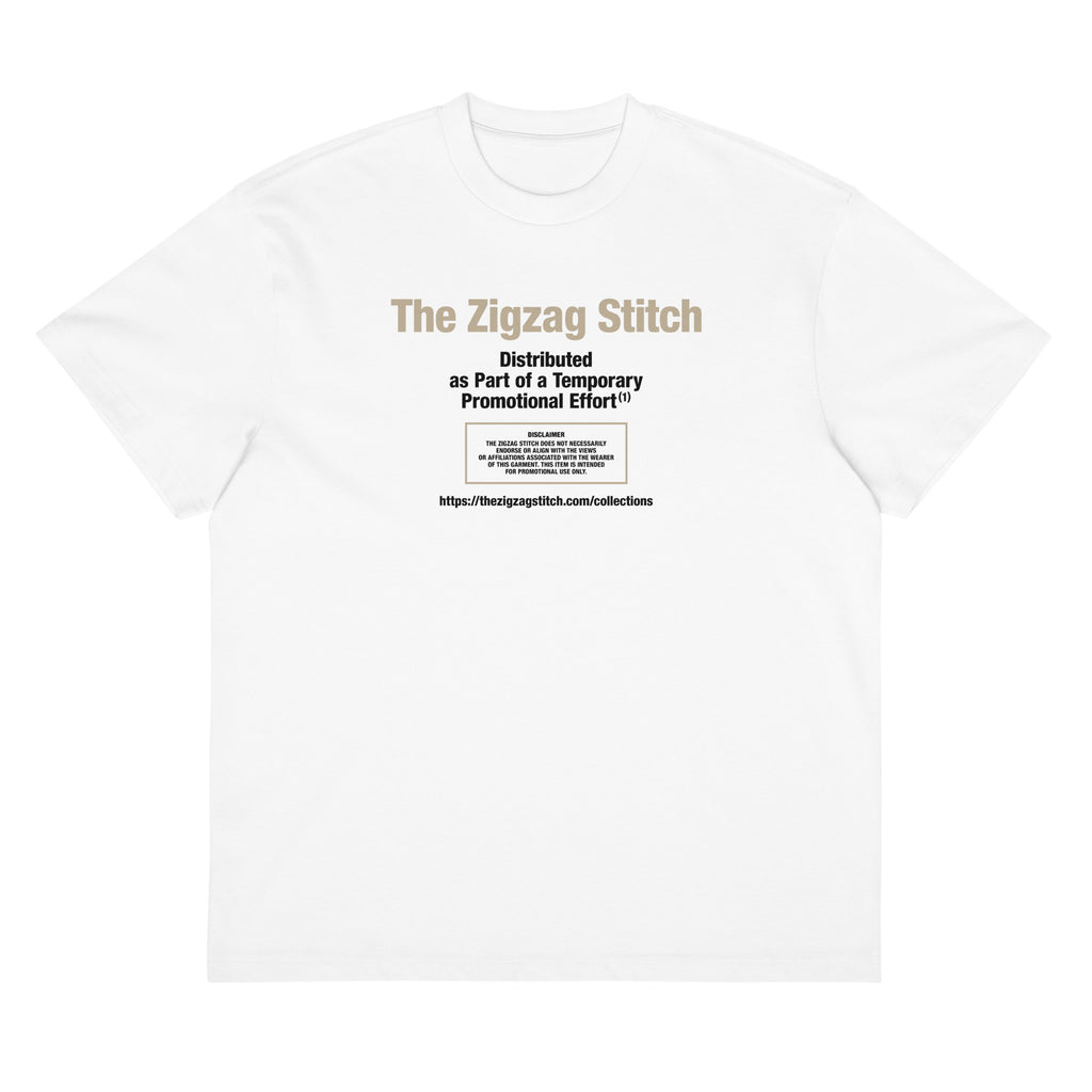 White t-shirt with graphic print. Reads “Distributed as Part of a Promotional Effort” designed by The Zigzag Stitch
